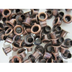 10 ojetes cobre viejo. . Scrapbooking, Indispensables, Brads y eyelets