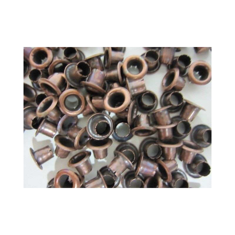 10 ojetes cobre viejo. . Scrapbooking, Indispensables, Brads y eyelets