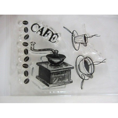 Molinillo y granos de café. Tazas.